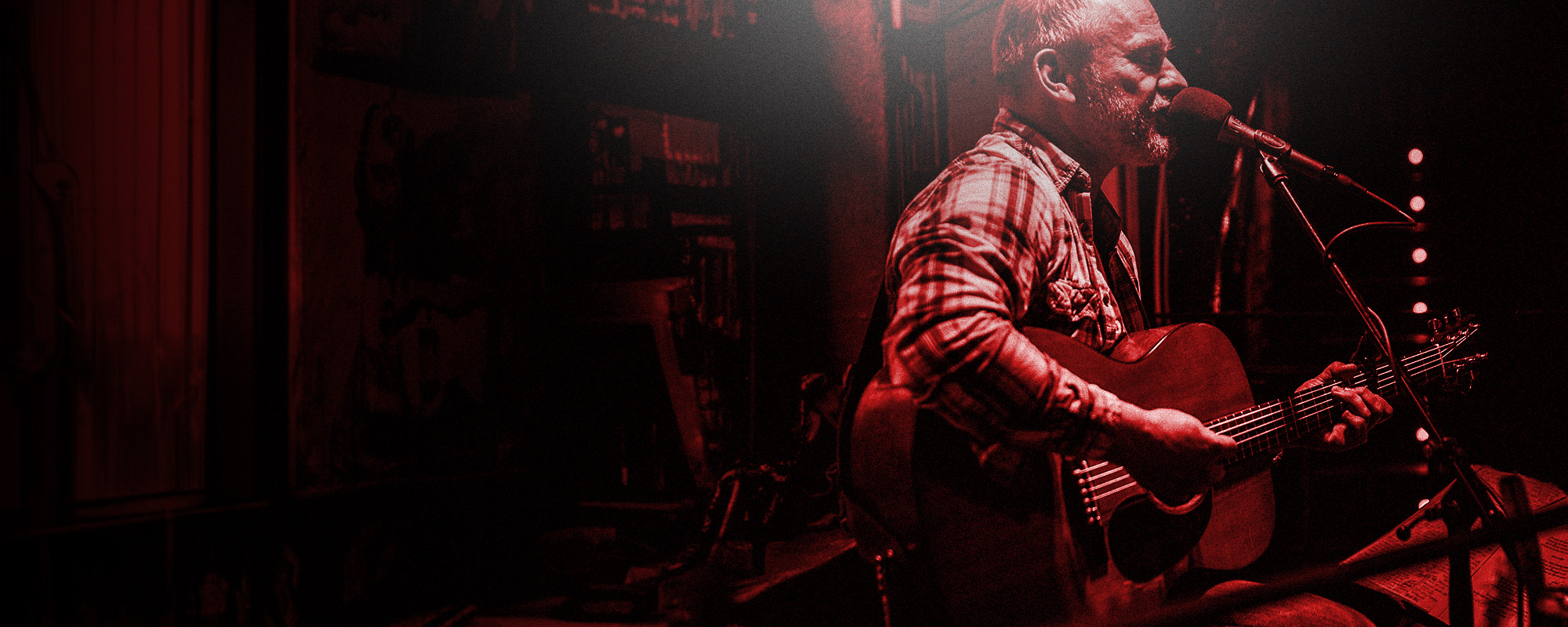 Harbinger Pro Audio Man Playing Acoustic Guitar