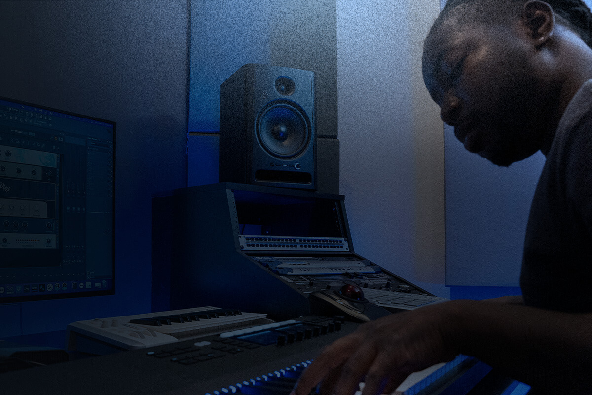 Harbinger Pro Audio SM508 Person In Studio With Two Monitors