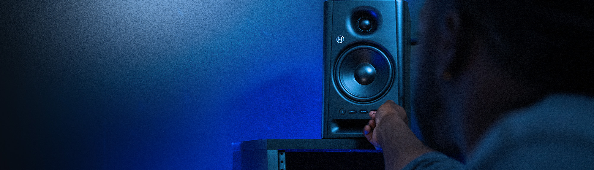 Harbinger Pro Audio SM505 Man Adjusting Volume On Studio Monitor Mobile