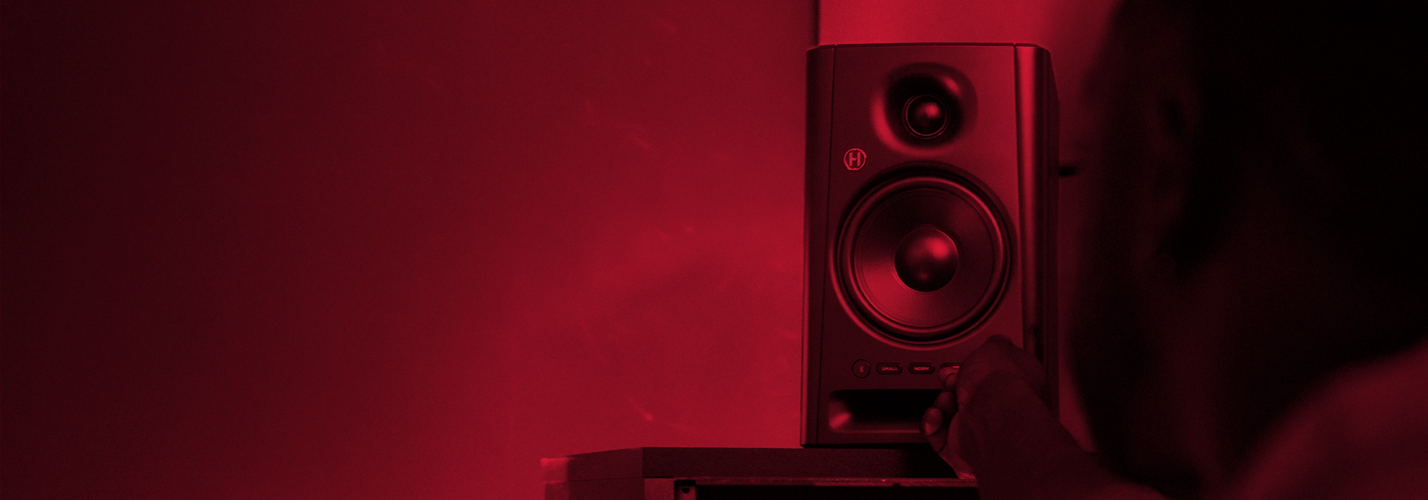 Harbinger Pro Audio Studio Monitor SM505 Man Adjusting Volume