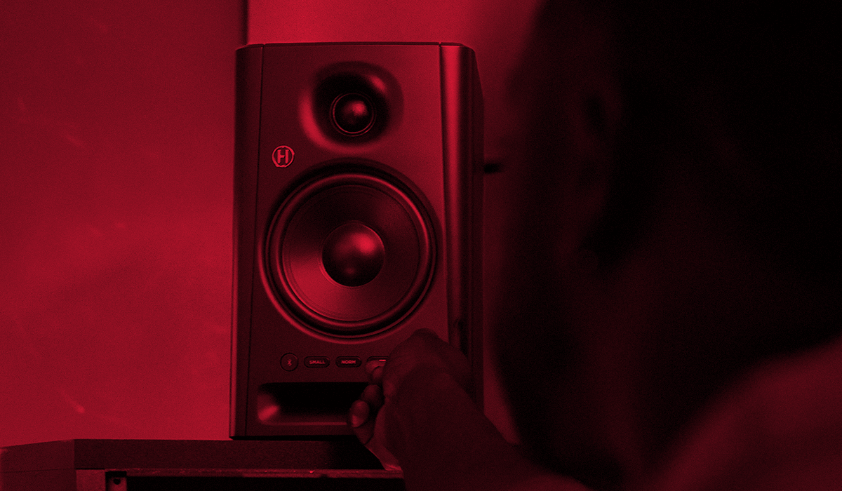 Harbinger Pro Audio Studio Monitor SM505 Man Adjusting Volume Mobile