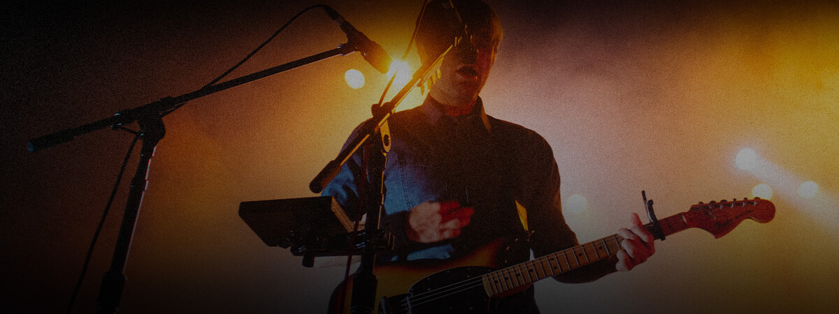 Man playing guitar on stage