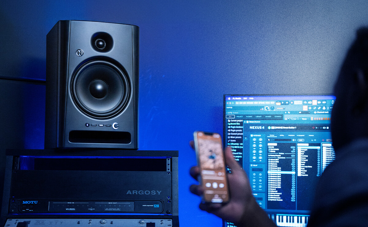 Studio Monitor in Recording Studio with speakrs on top of the mixer